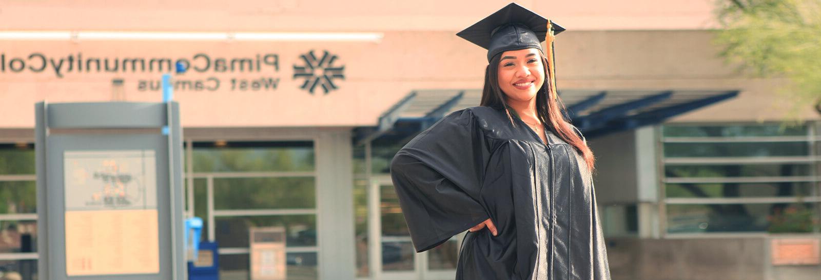 加芙Fragozo stands smiling outside of the Student Service Center at Pima's West Campus