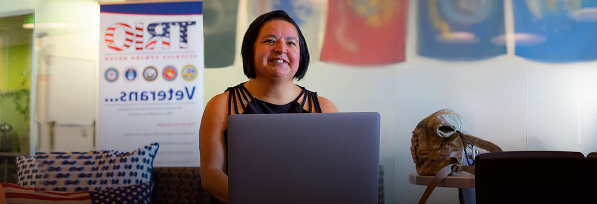 Angie Buenrostro sits smiling in the veterans center at Northwest Campus